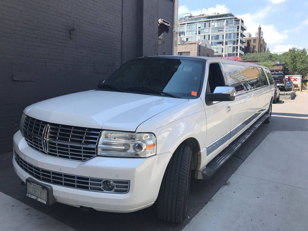 white suv limo Performance Auto Group LLC